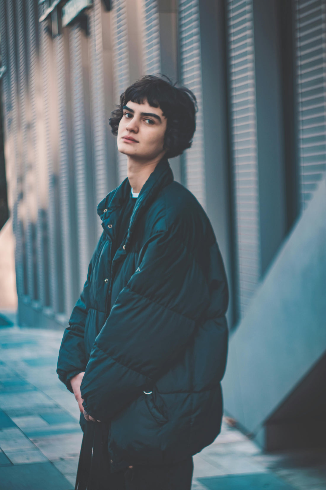 Man in a warm winter coat standing on a city street
